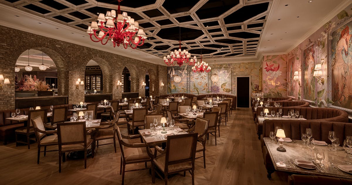 a room filled with furniture and a fire place and a dining table